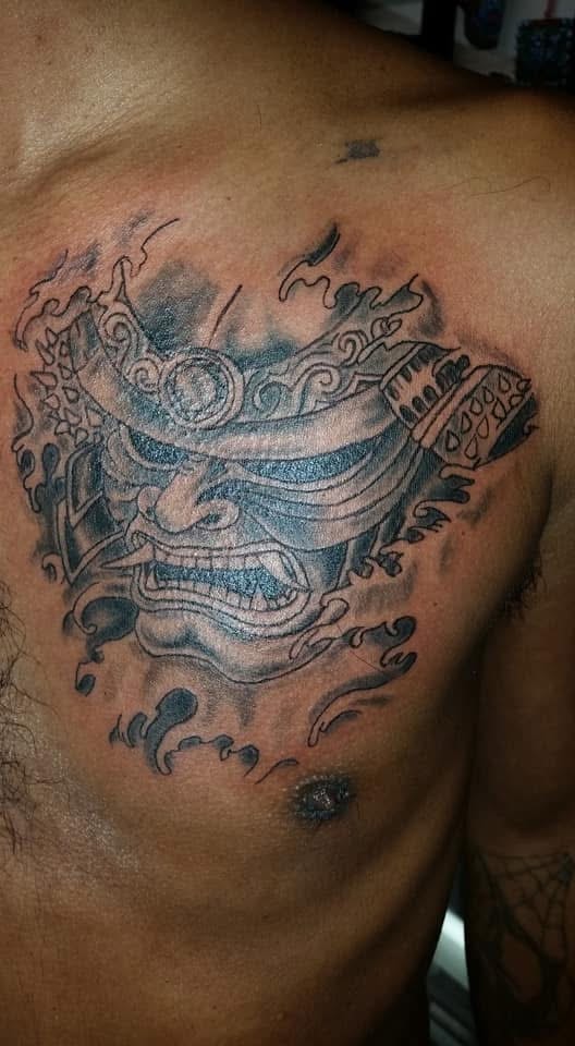 Japanese samurai oni mask black and grey chest tattoo