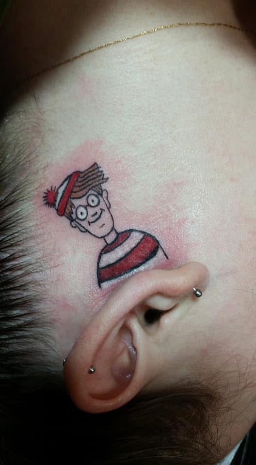 Where's Waldo character head tattoo behind ear