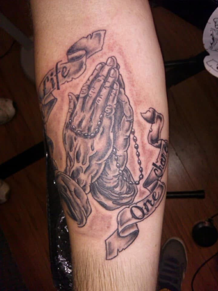 Praying hands with rosary beads Life One Chance banner forearm tattoo