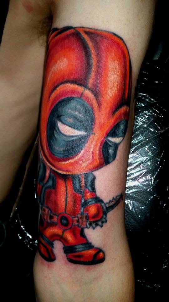 Chibi Deadpool colorful character arm tattoo