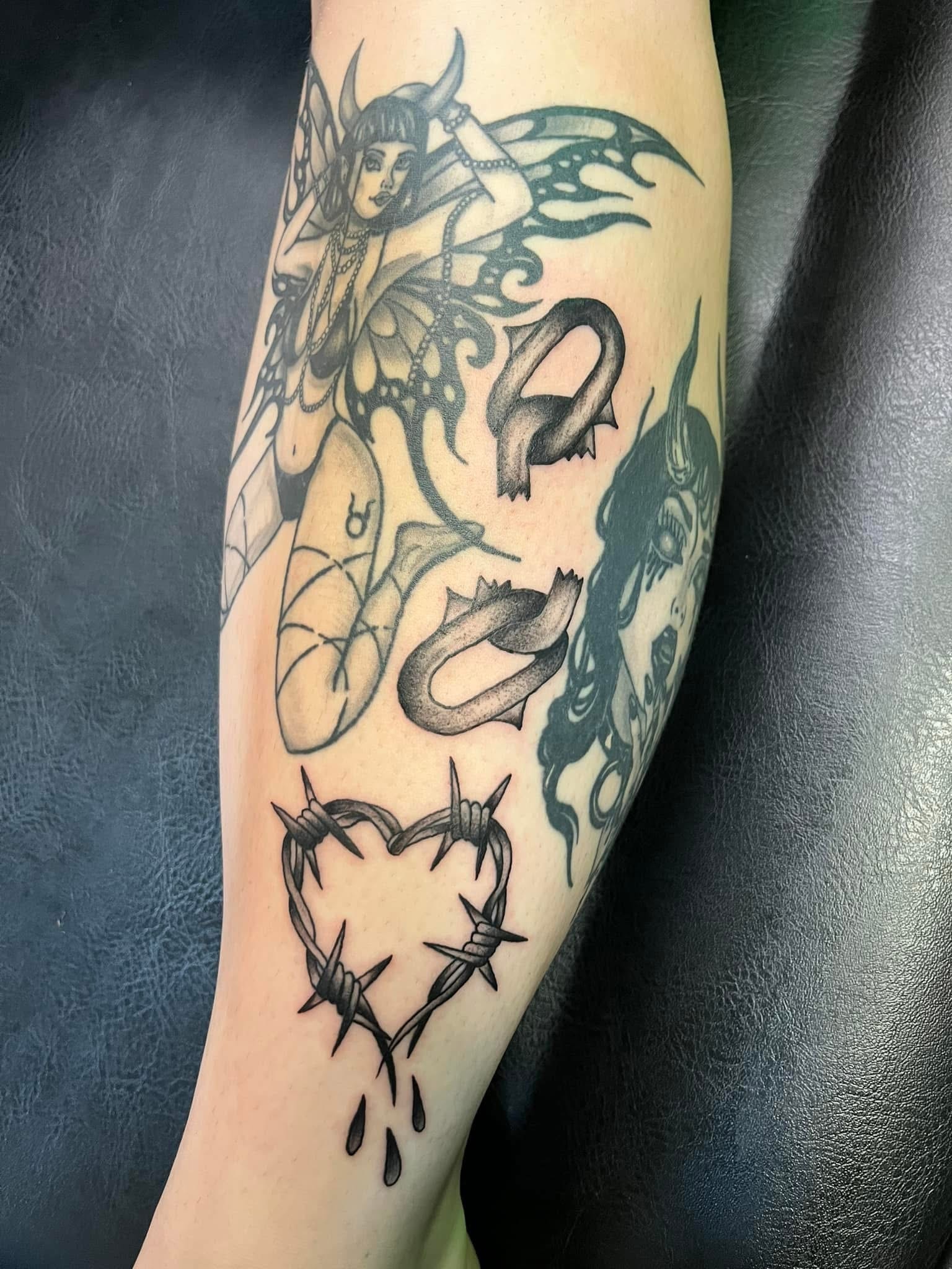 Dark fairy with barbed wire heart leg sleeve tattoo