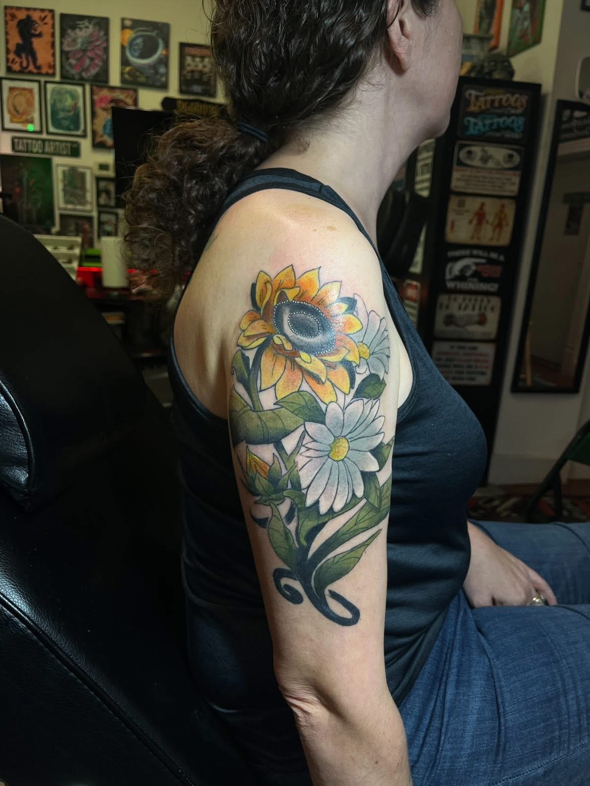 Colorful sunflower and daisy shoulder tattoo