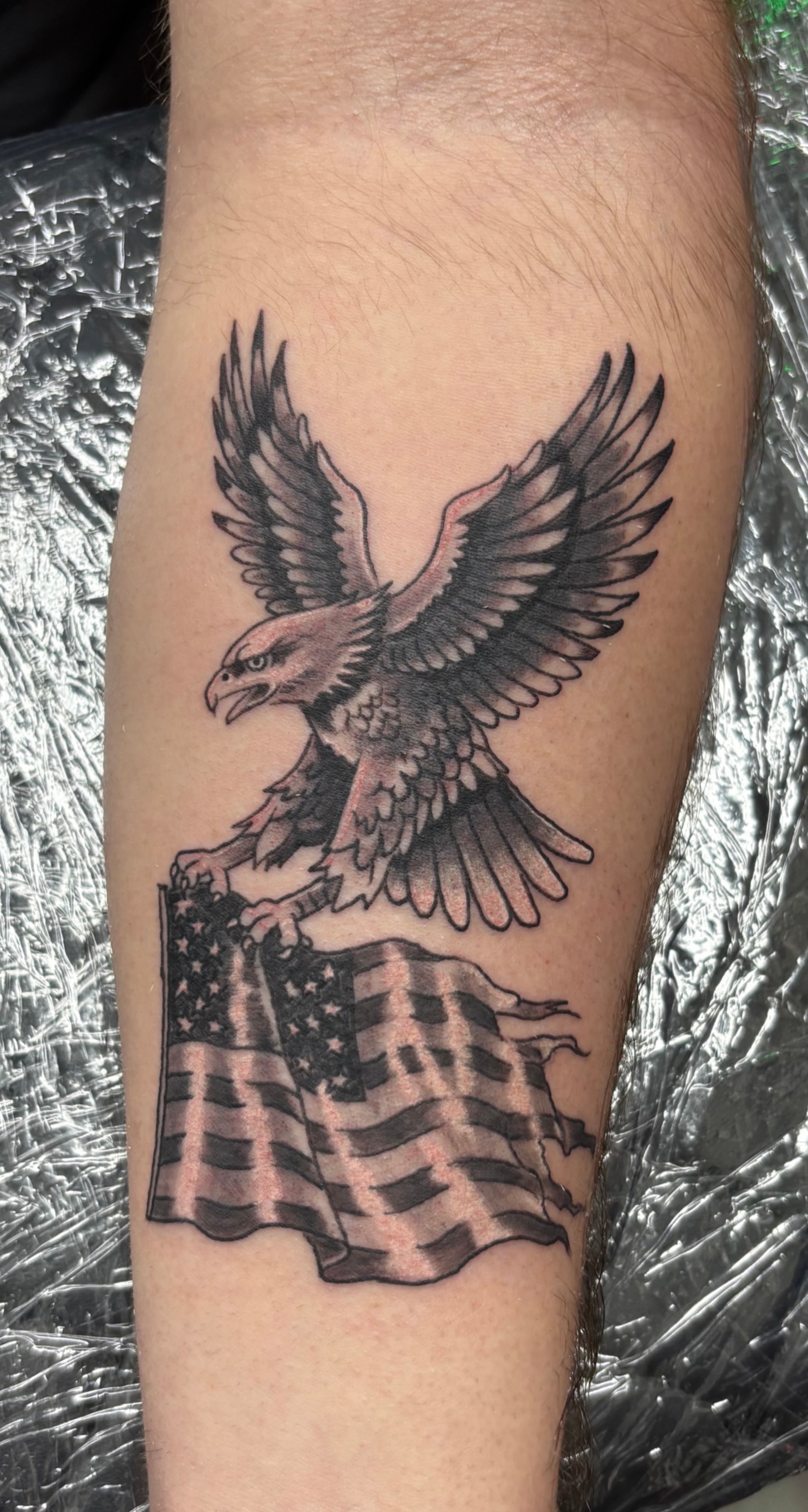 Randy DeShong eagle and American flag tattoo
