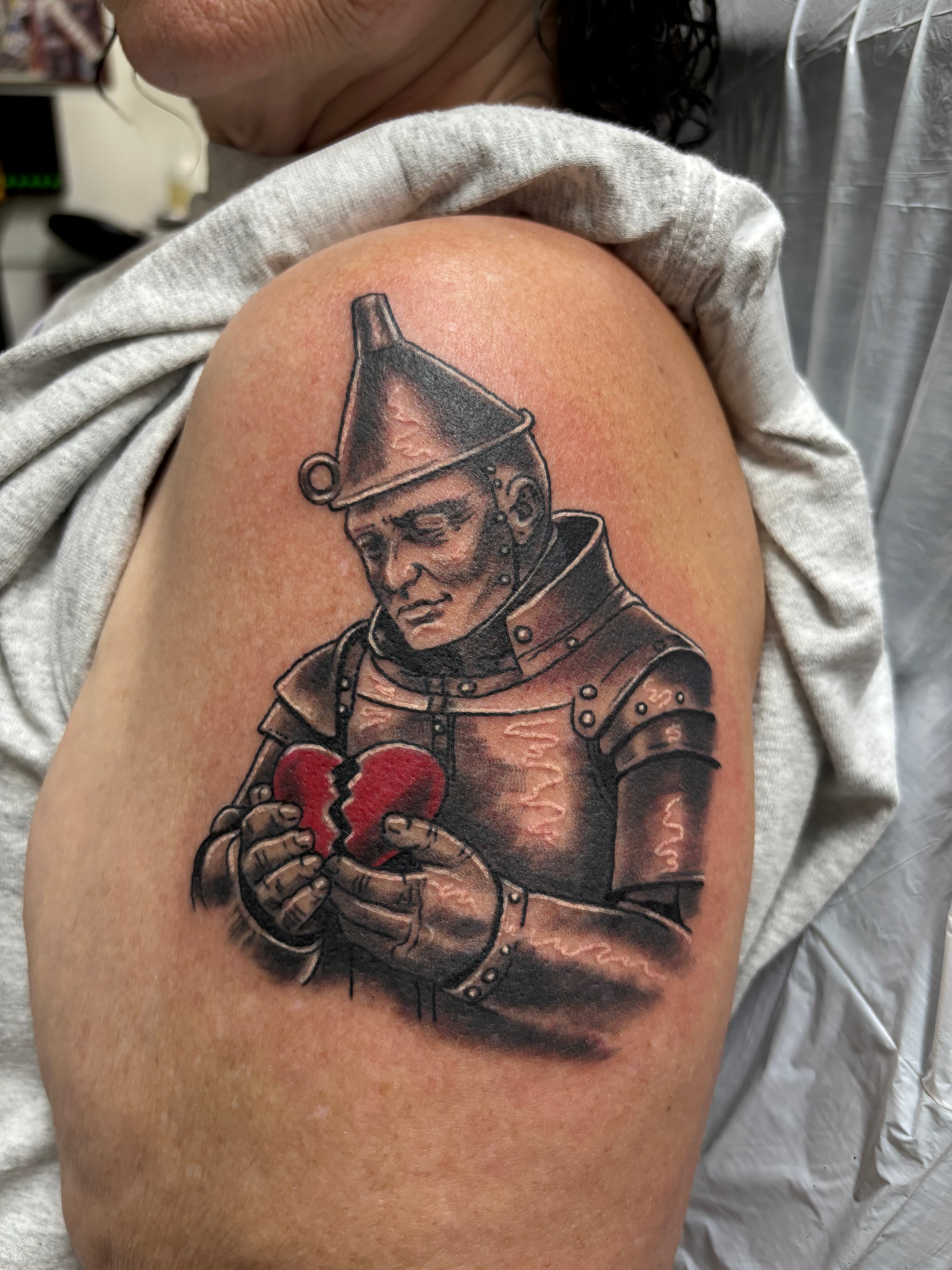 Randy DeShong Tin Man holding broken heart knee tattoo